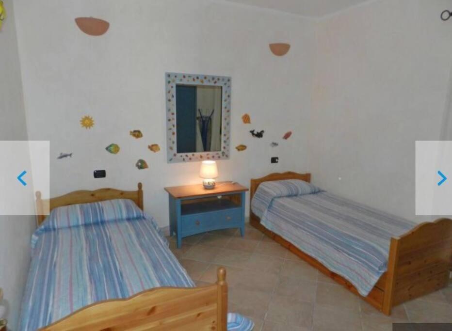 Apartment Pied Dans L'Eau Golfo Aranci Bagian luar foto